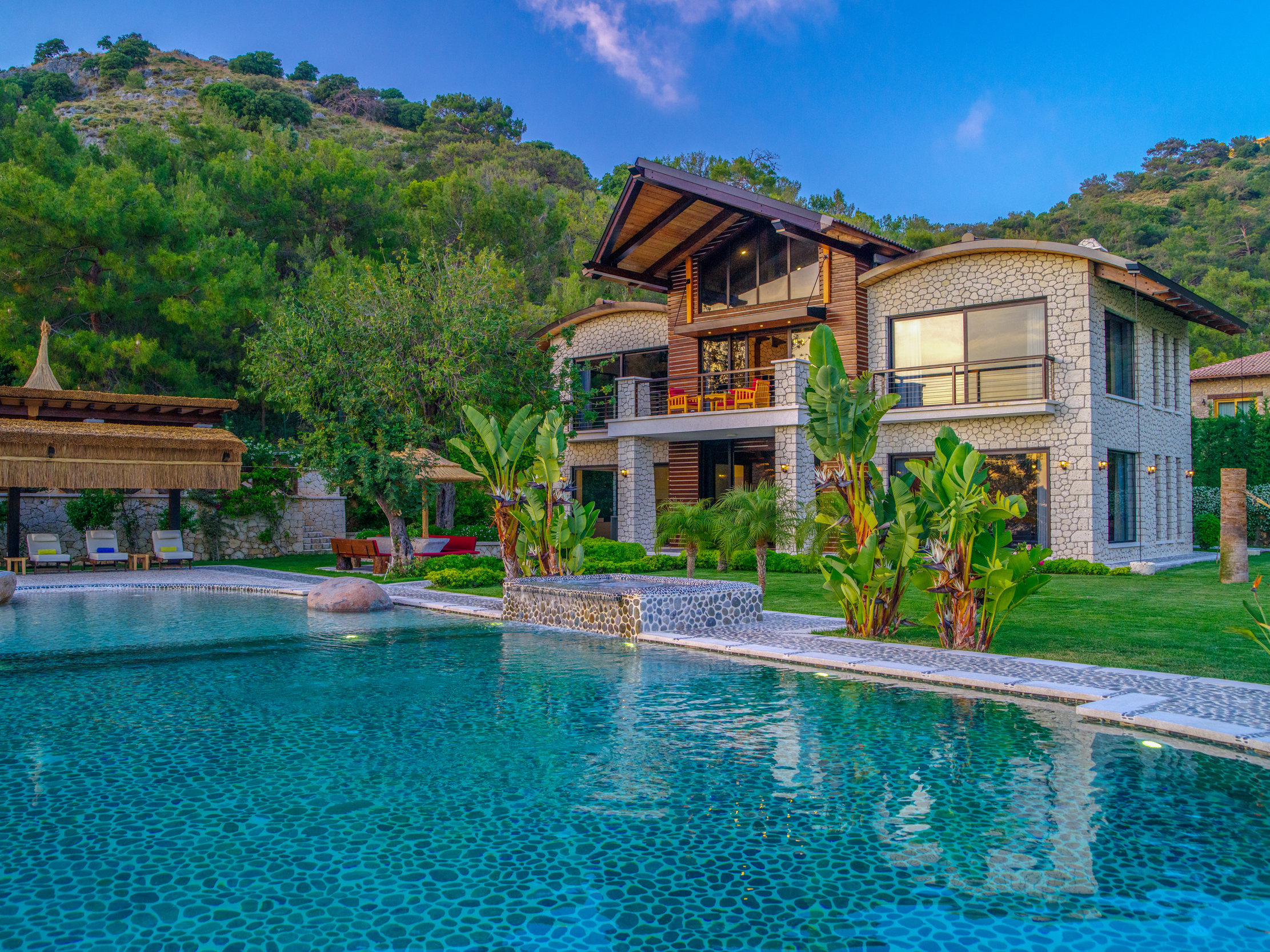 Villa gokce main facade infinity pool tropical garden